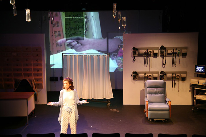 Paul Clay's Set Design, Lighting Design, and Video Design, for the production entitled Not God, Video Projection of hands.