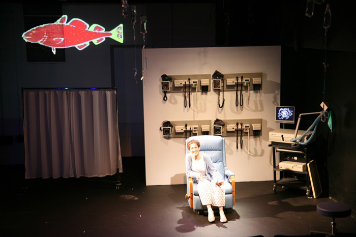 Paul Clay's Set Design, Lighting Design, and Video Design, for the production entitled Not God, a lighter moment.