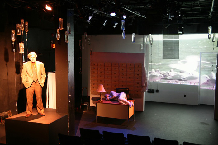 Paul Clay's Set Design, Lighting Design, and Video Design, for the production entitled Not God, Ocean Projections.