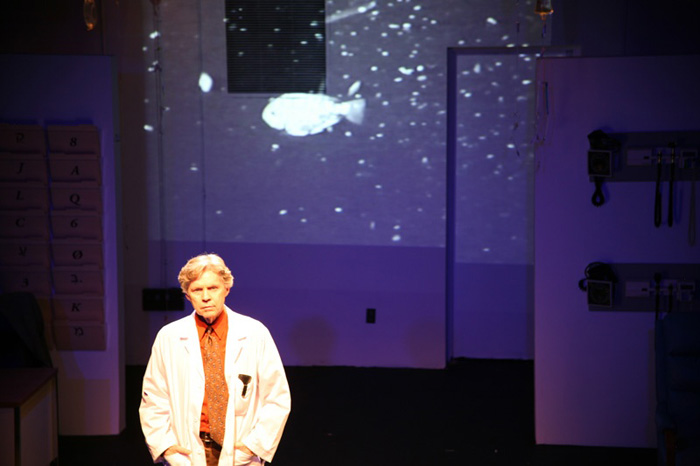 Paul Clay's Set Design, Lighting Design, and Video Design, for the production entitled Not God, Down Stage Iso.