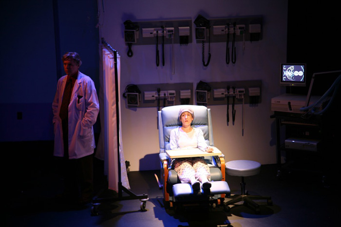 Paul Clay's Set Design, Lighting Design, and Video Design, for the production entitled Not God, Doctor sensing Patient.