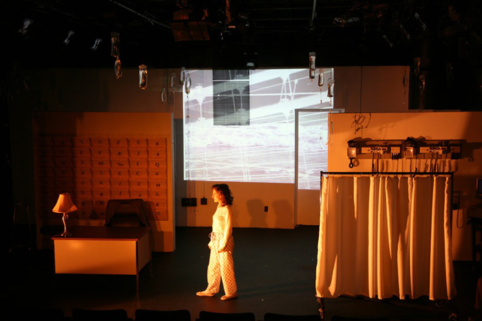 Paul Clay's Set Design, Lighting Design, and Video Design, for the production entitled Not God, Patient Passing.