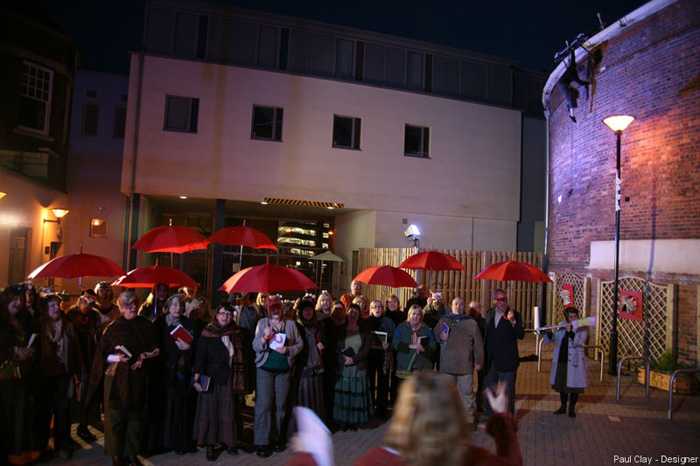 Paul Clay's Set Design, Lighting Design, and Video Design, for National Theatre Wales, Volcano Theatre, Welsh National Opera's co-production entitled Shelf Life at the Old Swansea Library, Wales, UK - chorus, exterior courtyard.